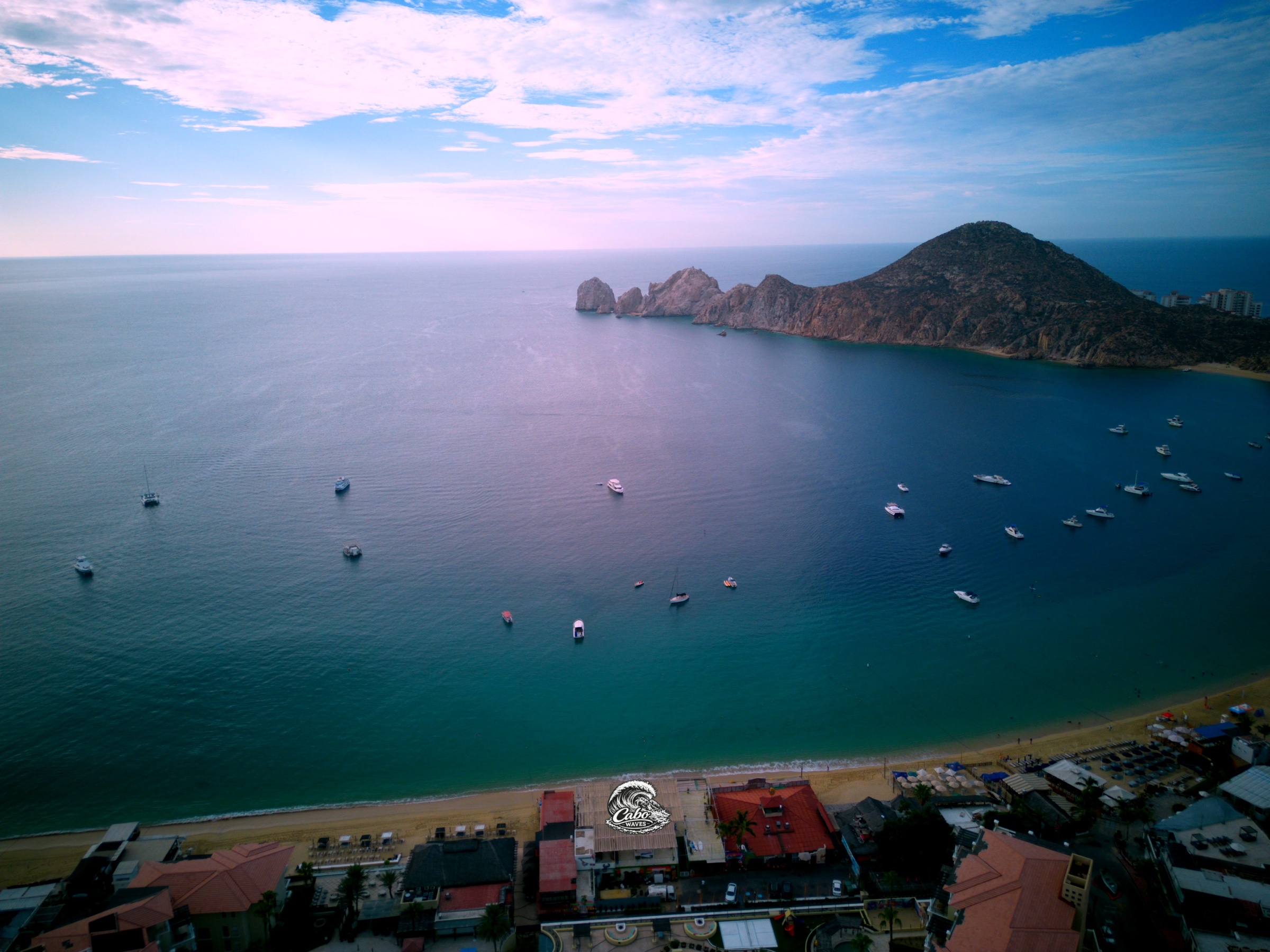 Aerial panorama across Médano Bay toward Land’s End